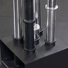 Close-up of a weightlifting bars on a black stand.