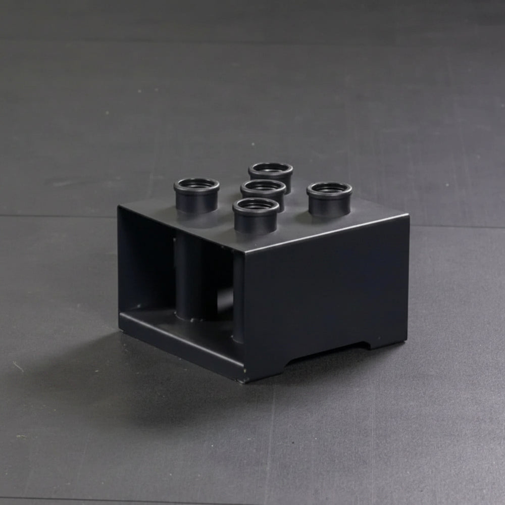Black gym equipment piece on a gray background