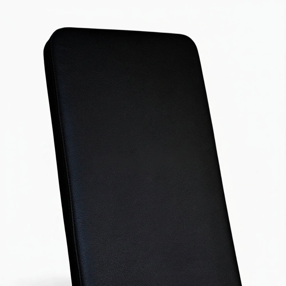 Black weight bench cushion on a white background