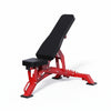 Red and black weight bench on a white background