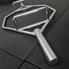 Metallic trap bar on a black surface