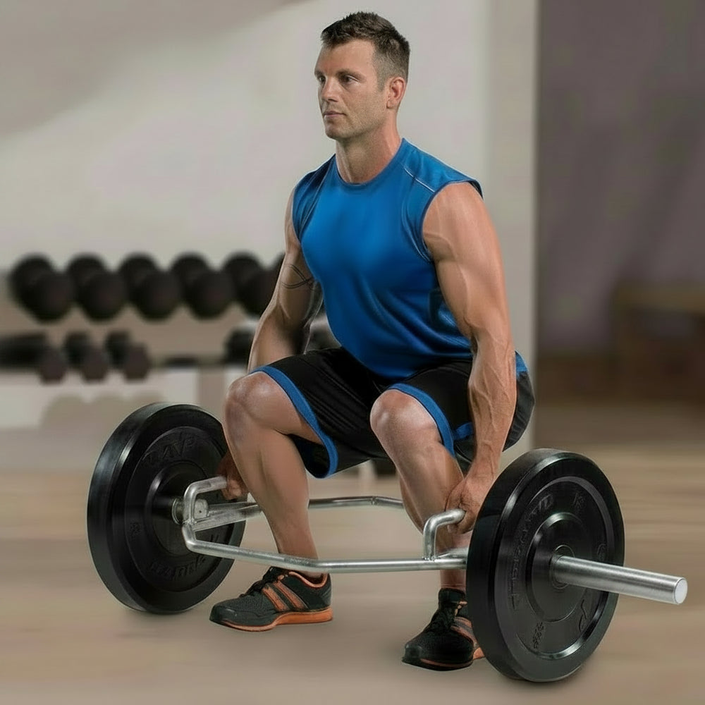 Man performing a barbell squat in a gym setting