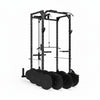 Black weightlifting power rack with attached weight plates on a white background