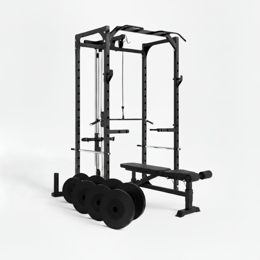 Black gym power rack with weight plates and bench on a white background
