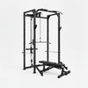 Black weightlifting cage with bench and weights on a white background