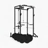 Black power rack with weight plates on a white background