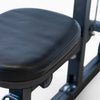 Black exercise bench with a cushioned seat on a white background