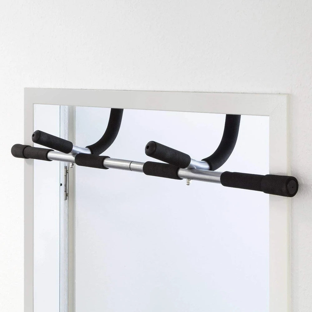 Pull-up bar attached to a door frame on a white background
