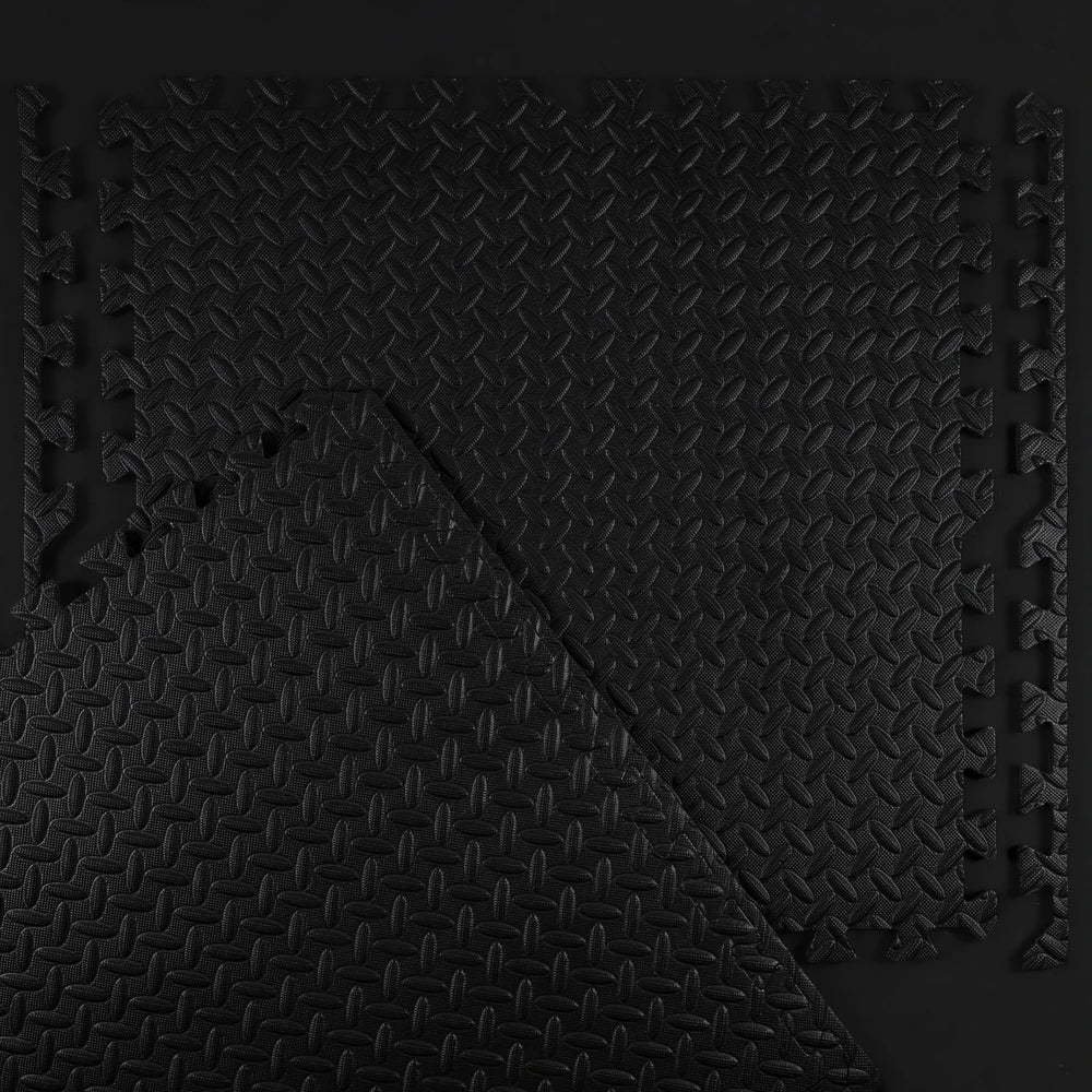 Black textured mat with a geometric pattern on a black background