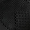 Close-up of a textured black mat with a geometric pattern