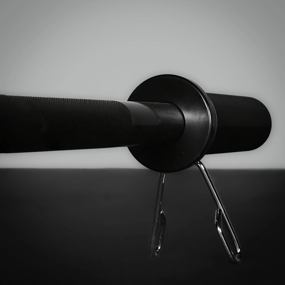 Barbell with weight grips on a gray background