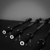 Metal barbells with circular clips on a dark background