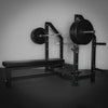 Weight bench with barbell loaded with weights in a gym setting