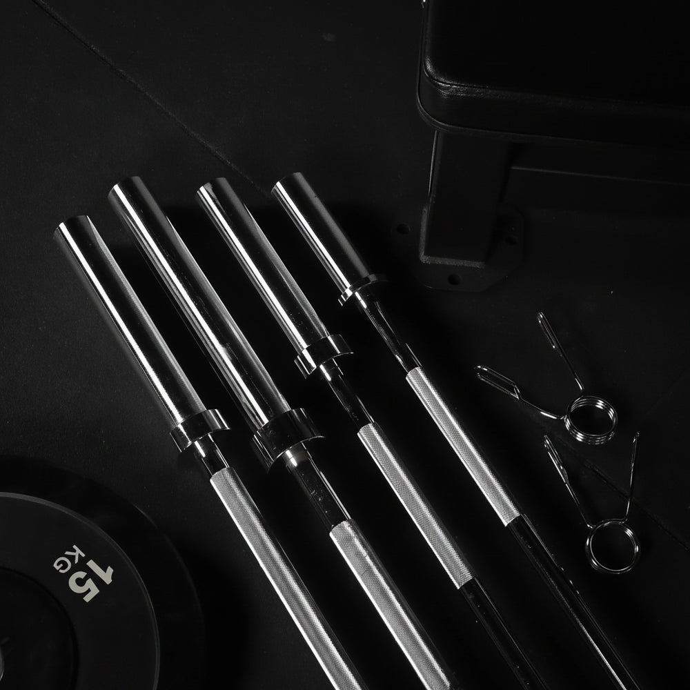 Set of metal barbell on a dark surface