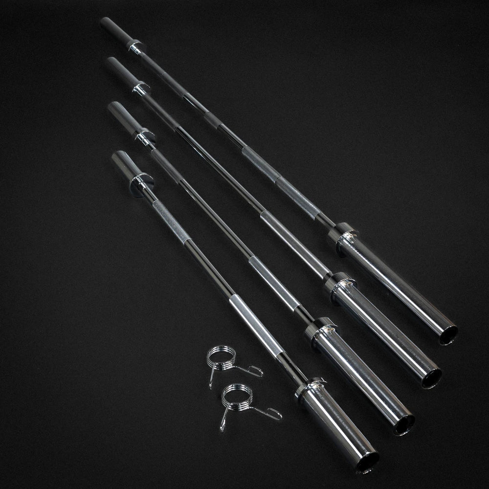Set of metal barbells on a black background