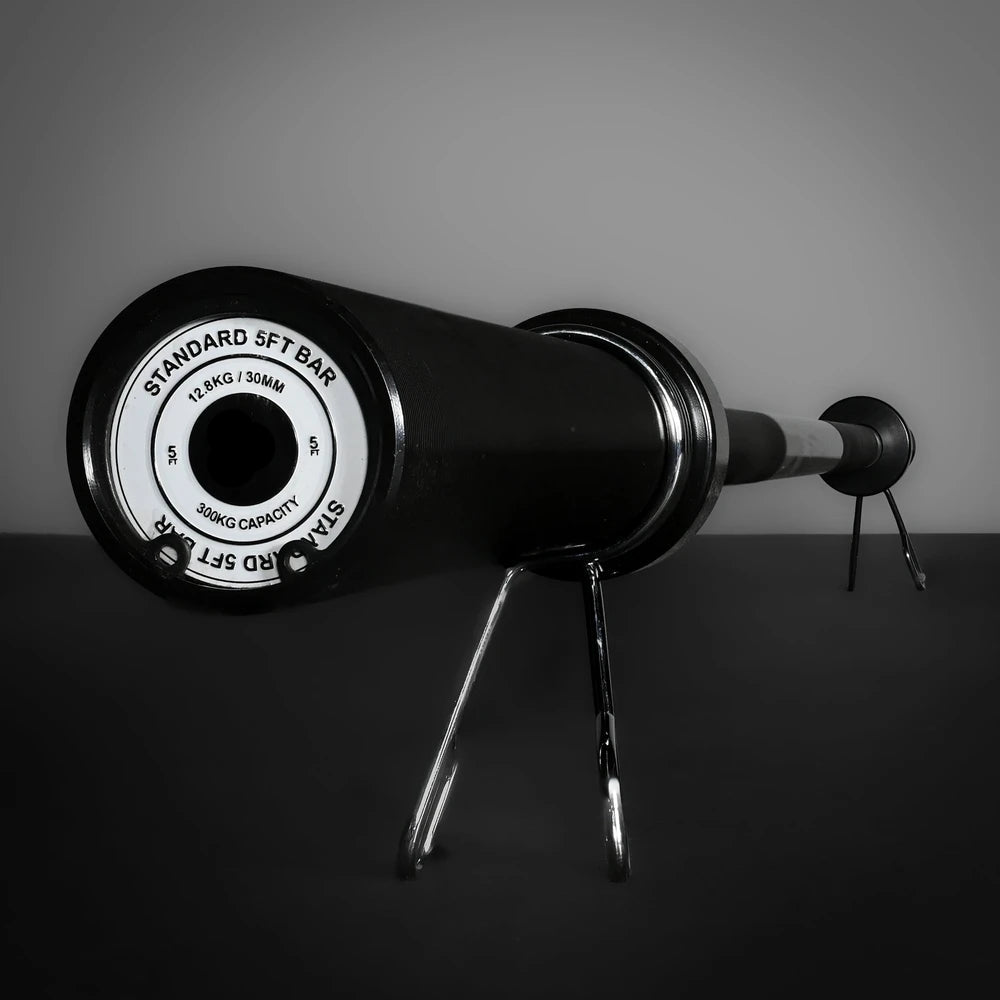 Barbell with weight plates on a dark background