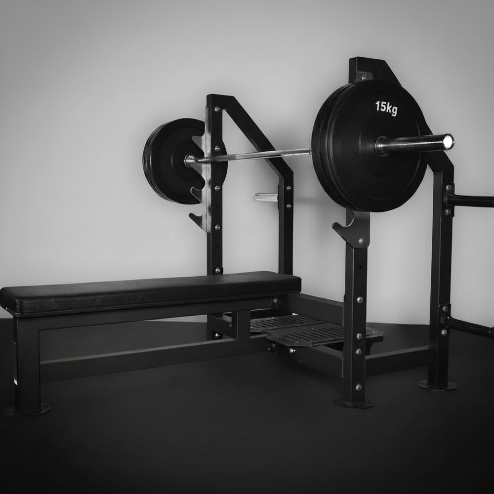 Gym equipment including a barbell with weights on a squat rack and bench.