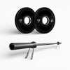 Two black weight plates and a barbell on a white background