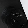 Black weight plates with white text and branding on a black background