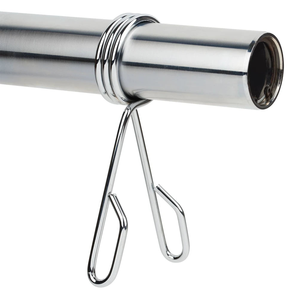 Close-up of a metal barbell clip on a white background