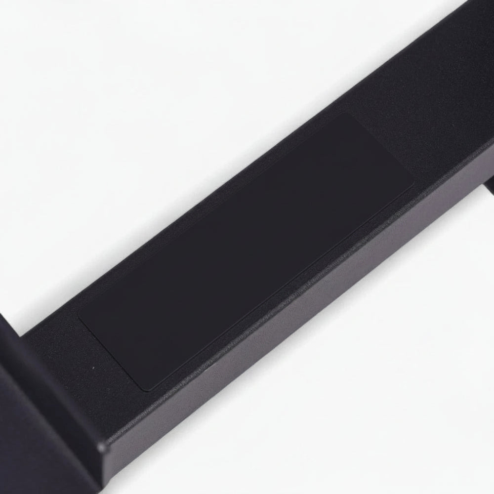 Black barbell plate on a white background