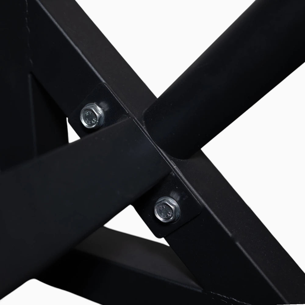 Close-up of a black metal frame with screws on a white background