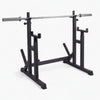 Black weightlifting squat rack with bar on a white background