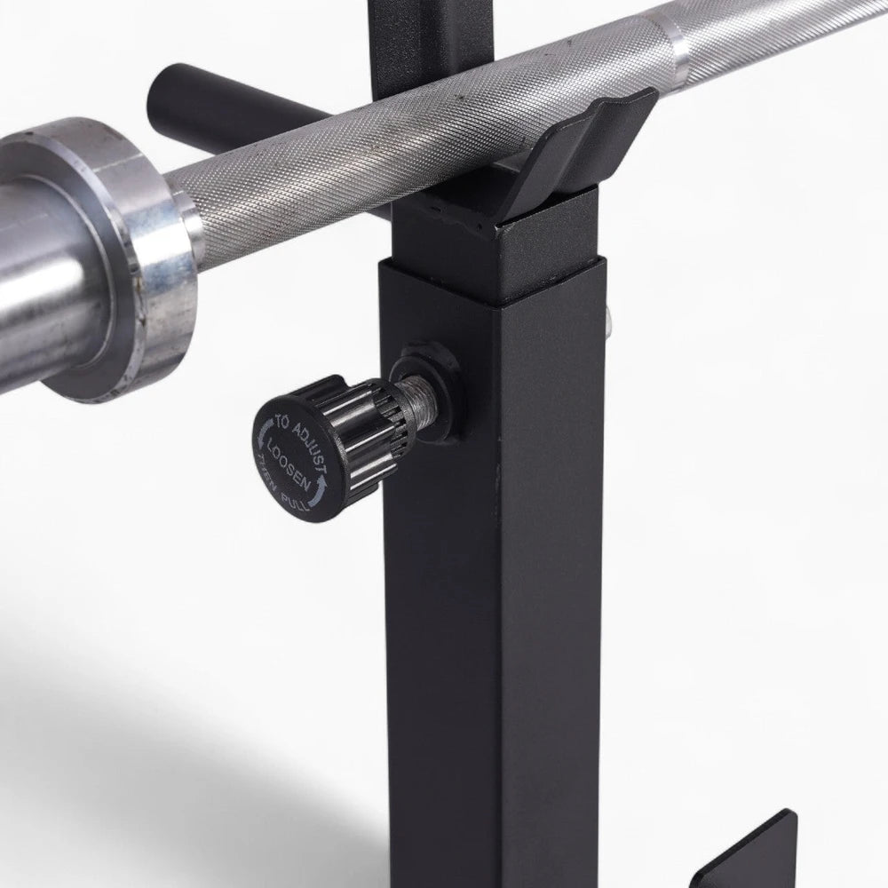 Close-up of a weightlifting bar attached to a black support structure with a white background.