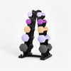 Set of dumbbells on a stand with weight labels on a white background