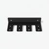 Black metal plate with multiple holes on a white background.