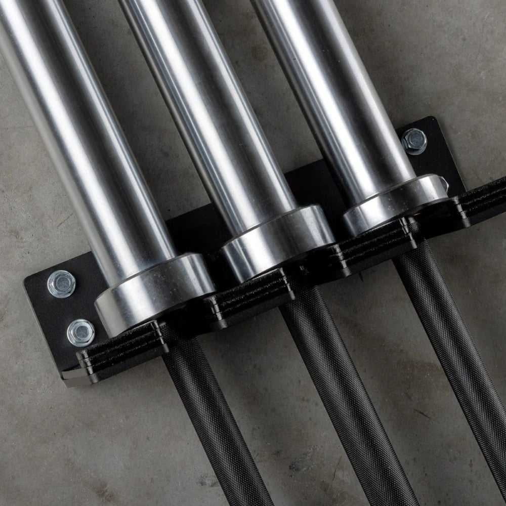 Close-up of metal pipes and brackets on a concrete surface