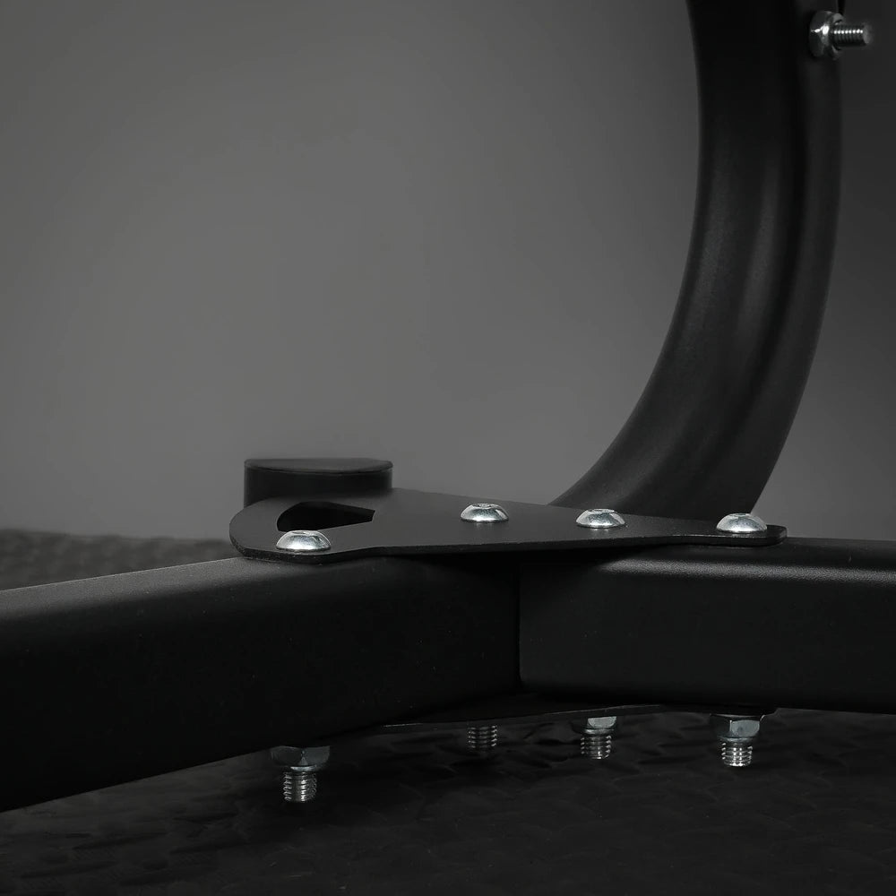 Close-up of a black metal bracket with screws on a dark background