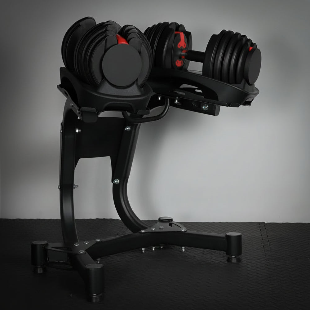 Pair of adjustable dumbbells on a stand against a gray background