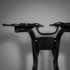 Black metal bike rack on a gray background