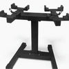 Black weightlifting stand with multiple barbell holders on a white background