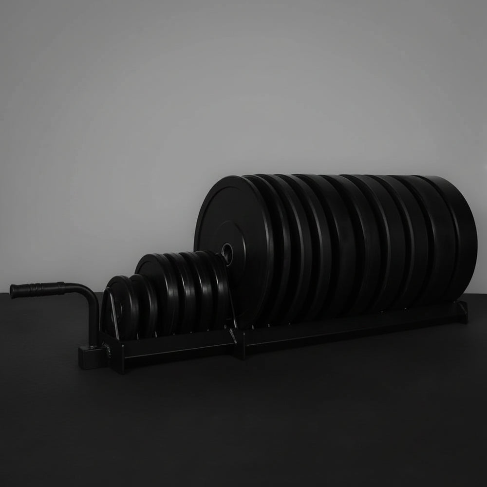 Set of weight plates on a stand against a gray background