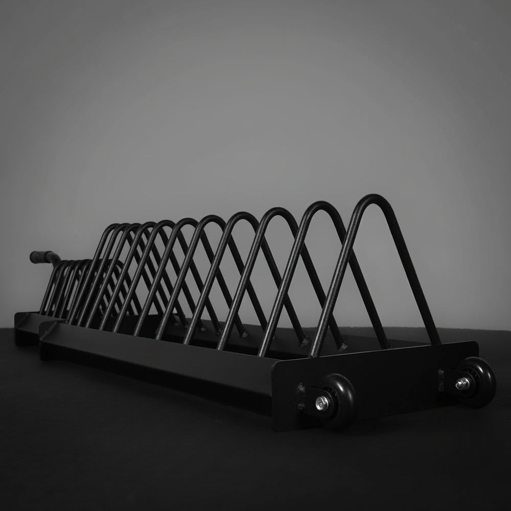 Black metal weight plate rack on a dark background