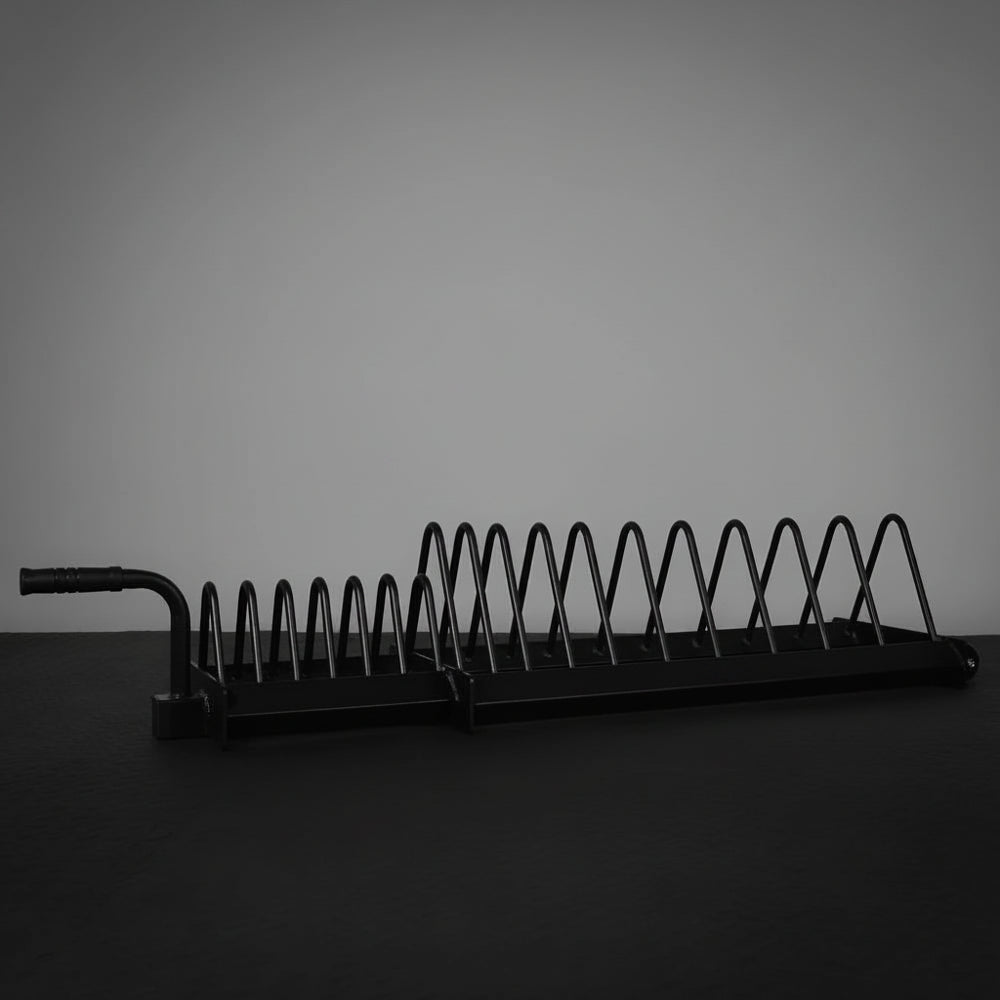 Metal weight rack with springs on a dark surface and gray background