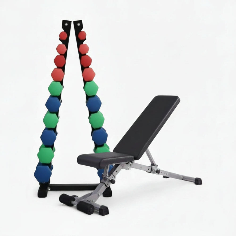 Dumbbell set with colorful weights and a weight bench on a white background