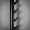 Black metal wall-mounted rack on a gray background