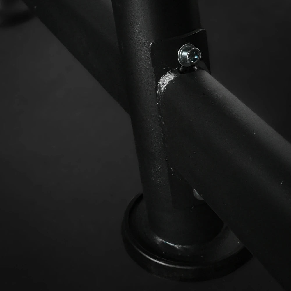 Close-up of a black metal bar with a bolt on a dark background