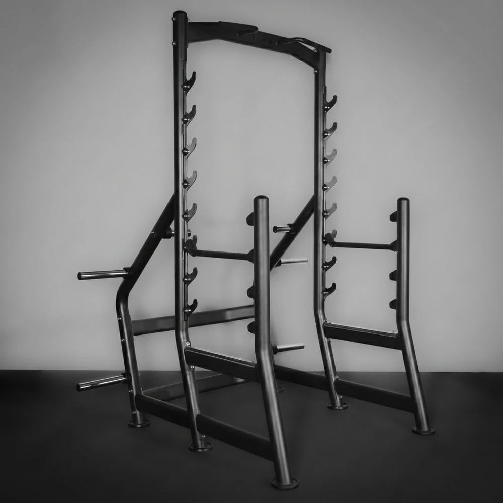 Gym power rack against a plain wall