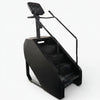 Black stair stepper exercise machine on a white background