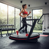 Woman exercising on a treadmill in a gym setting