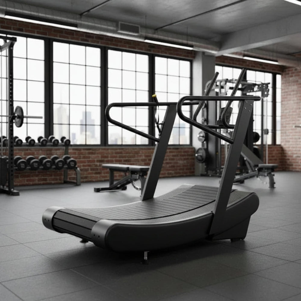 Treadmill in a gym setting with large windows and exercise equipment.