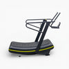 Gray and black elliptical machine with yellow accents on a white background