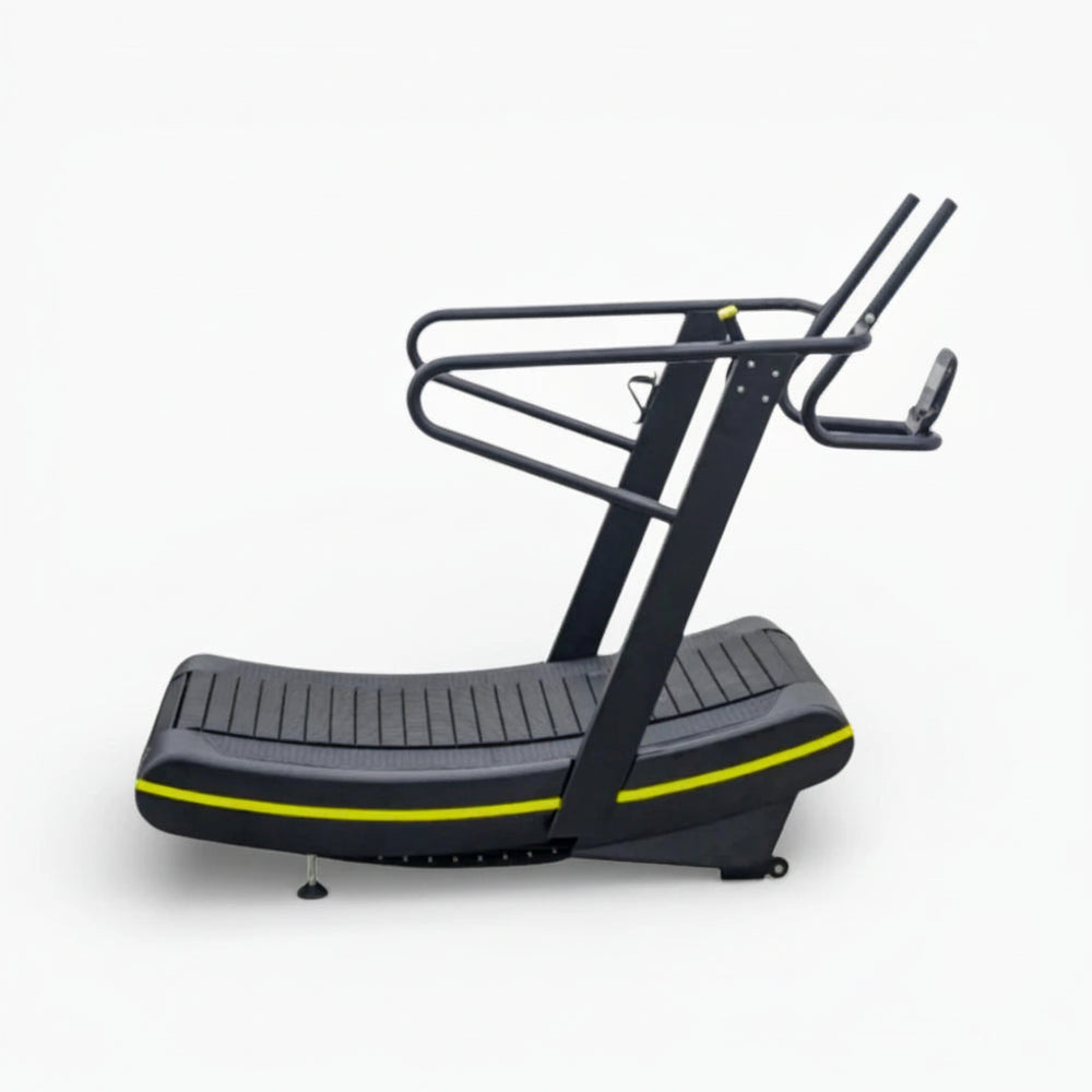 Gray and black elliptical machine with yellow accents on a white background