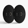Two black weight plates on a white background