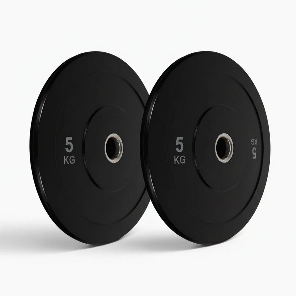 Two black weight plates on a white background