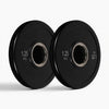Two black weight plates on a white background